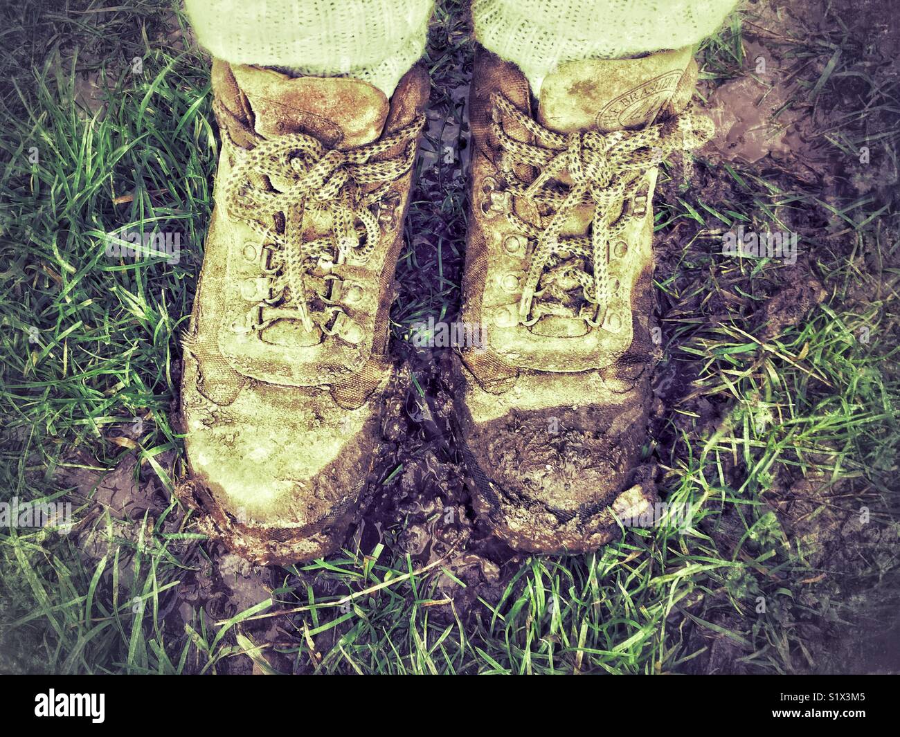 Muddy boots. - Smartphone Captured Stock Image
