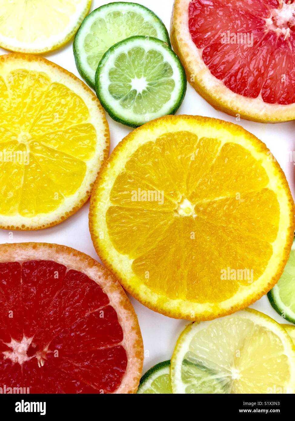 Citrus fruit slices on a white background Stock Photo