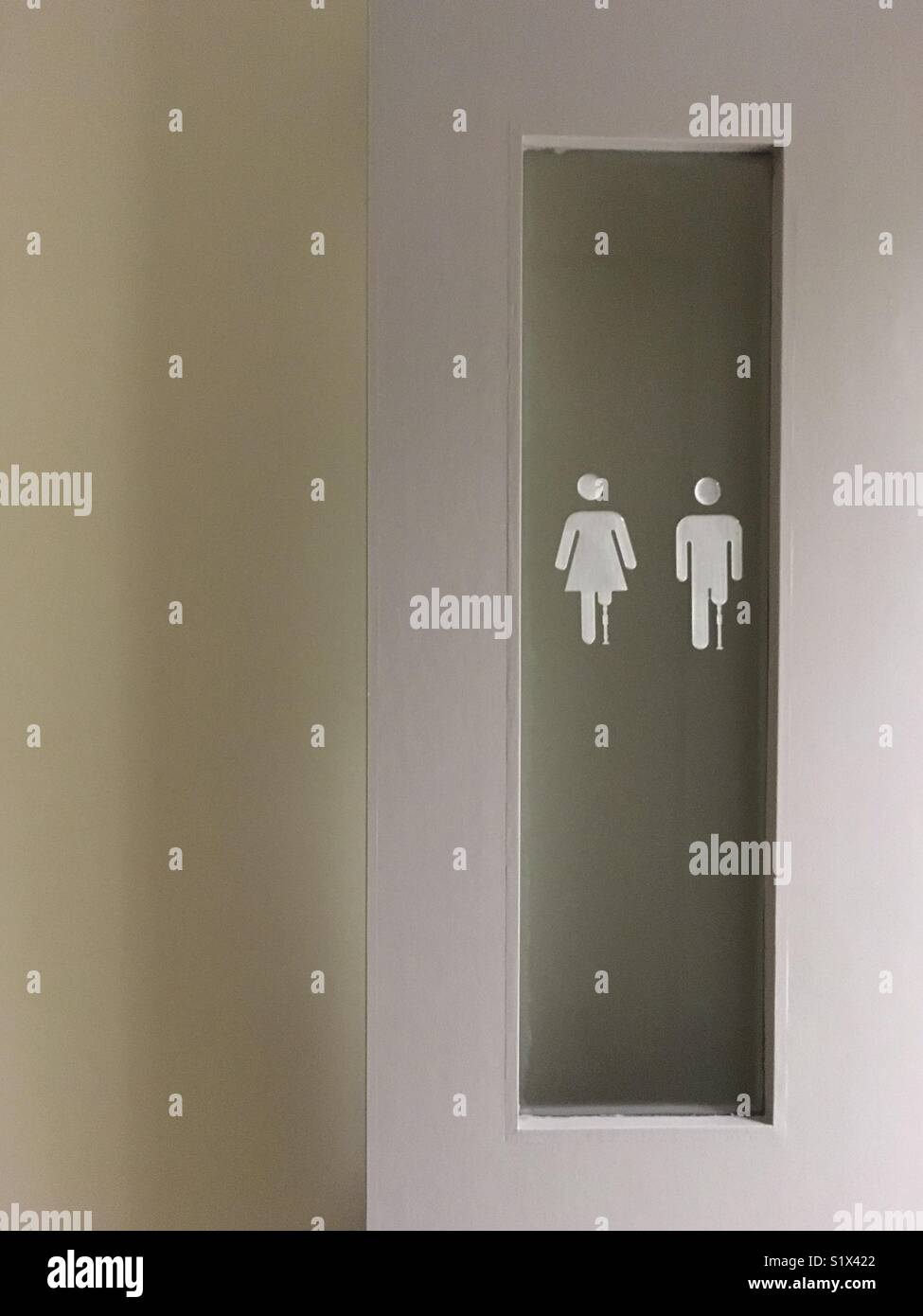 Sign on the door of a toilet for amputee. - Smartphone Captured Stock Image