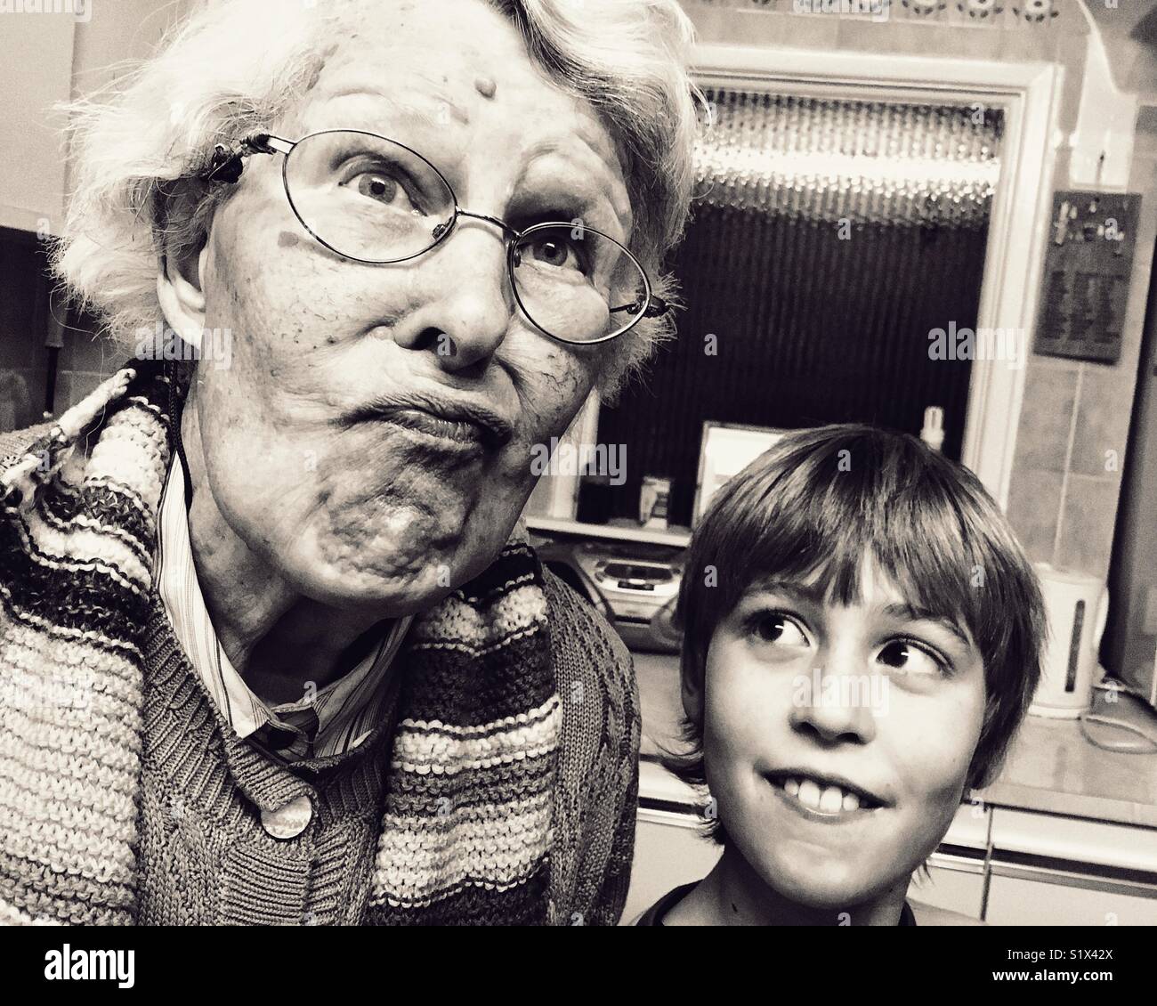 Old lady and young lad Stock Photo