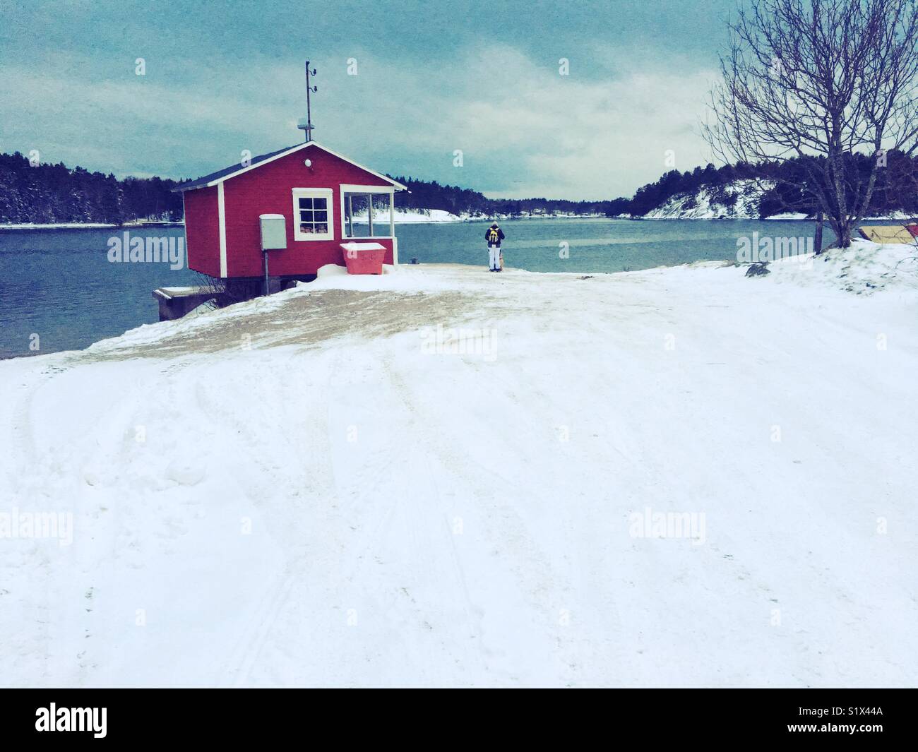 Jetty with shelter hut for ferry boats in Stockholm archipelago - Smartphone Captured Stock Image