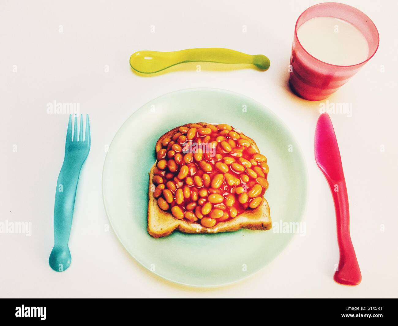 Children’s beans on toast and milk Stock Photo Alamy