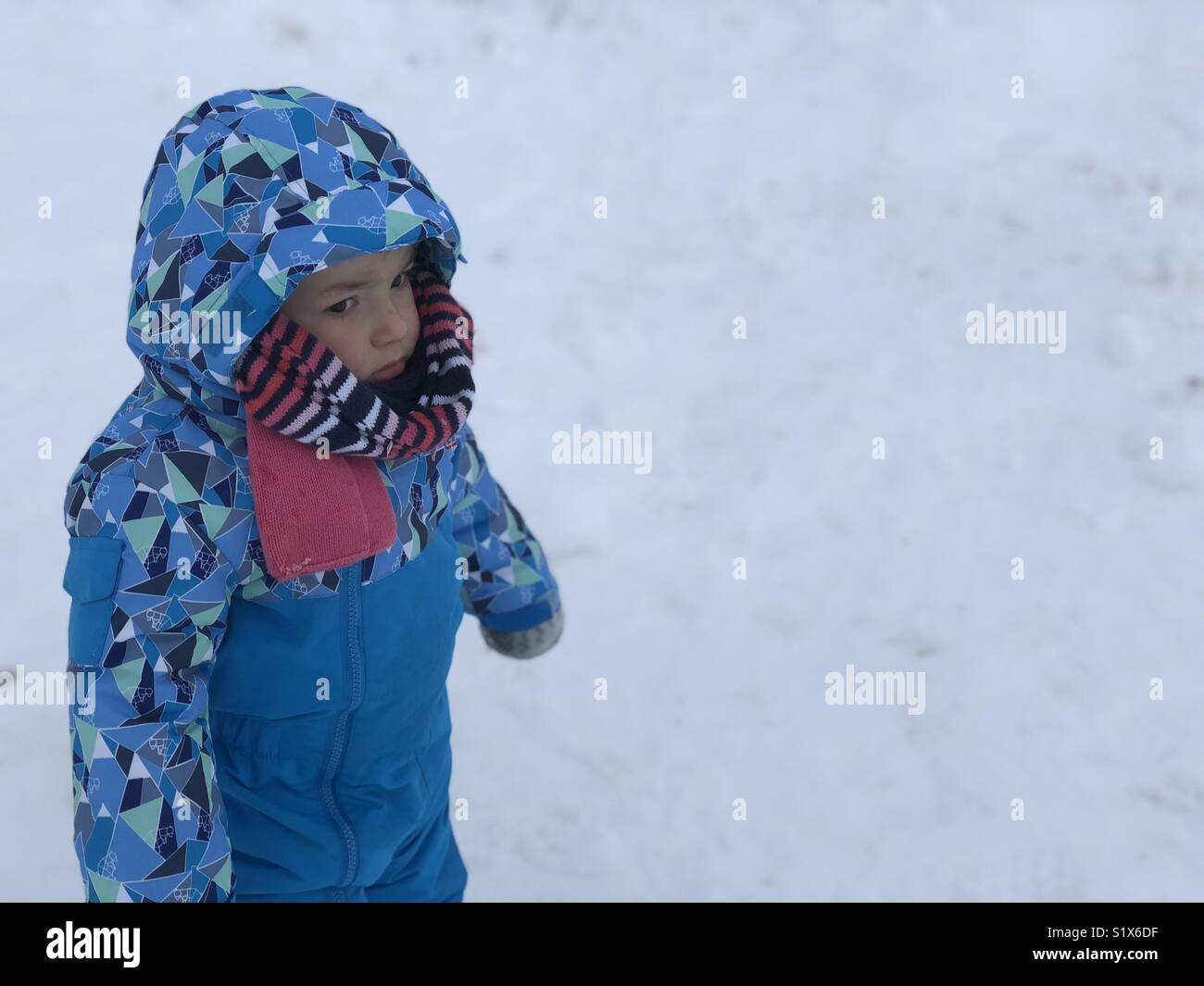 Portrait of Baby discovering the snow Stock Photo