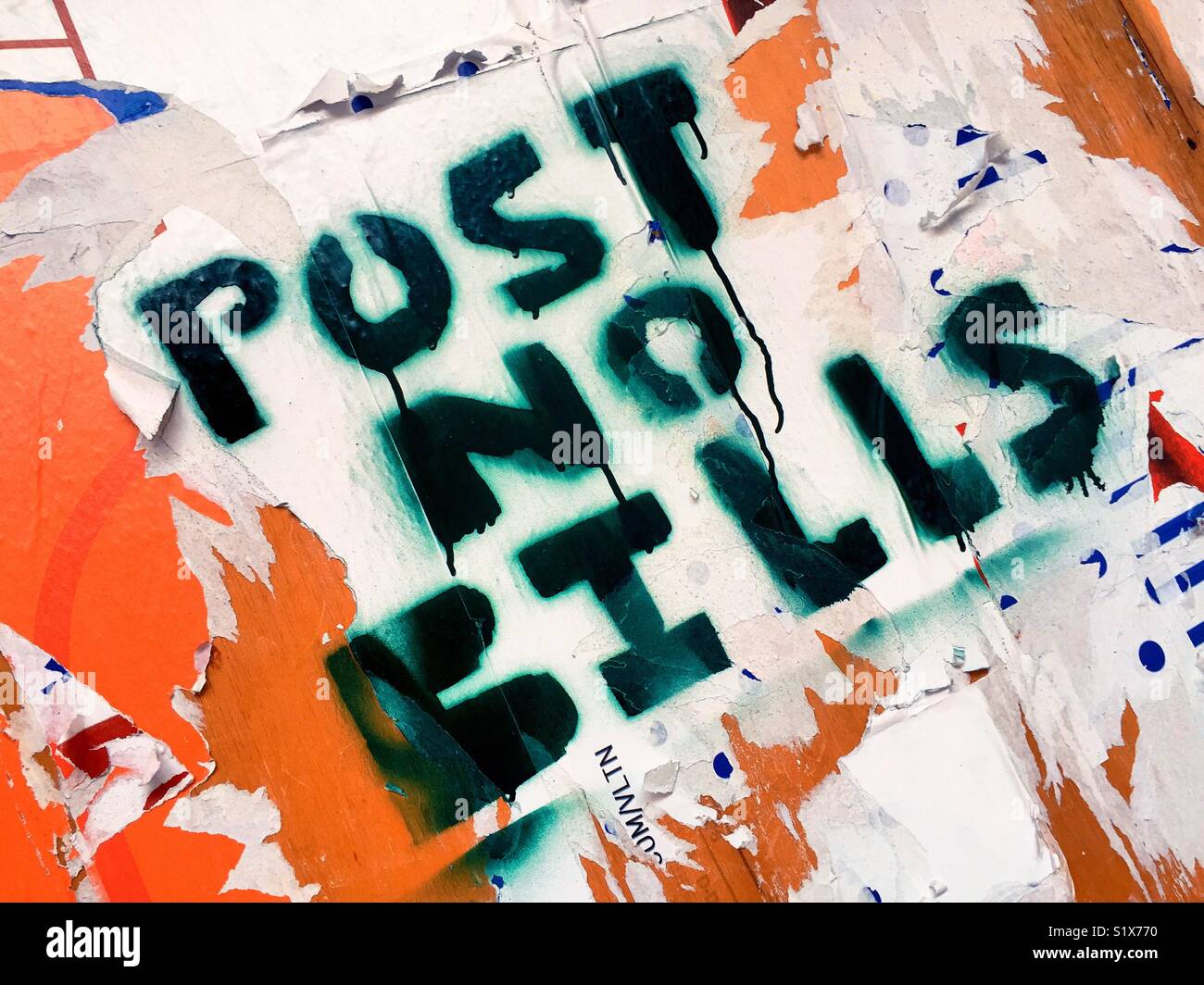 Post no bills sign painted over wooden wall covered with papers, New York City, USA - Smartphone Captured Stock Image