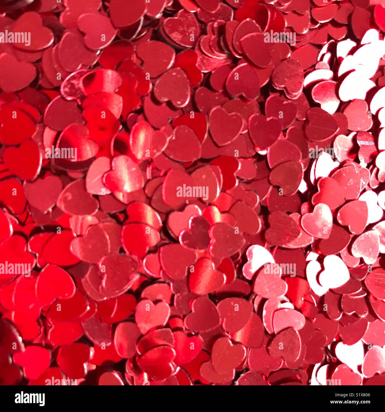 Red heart shaped sprinkles - Smartphone Captured Stock Image