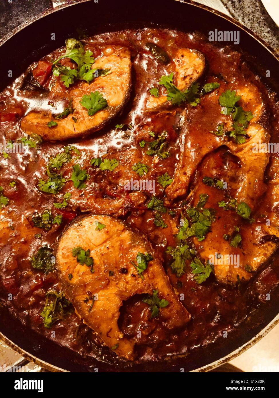 Home made Andhra Chepala iguru (fish curry) in a pan. Stock Photo