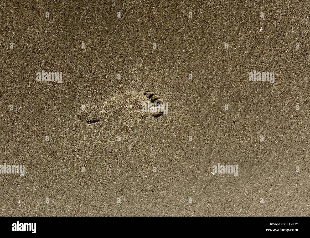 Footprint in the sand. - Smartphone Captured Stock Image