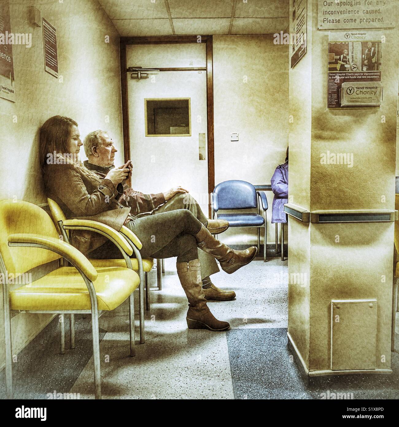 People in the waiting area of the Ophthalmology Department of an NHS Hospital, Yeovil, Somerset, England - Smartphone Captured Stock Image
