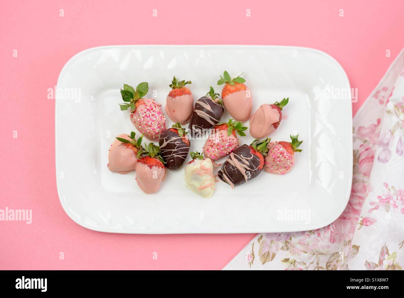Decorated Chocolate Dipped Strawberries On A White Plate For A