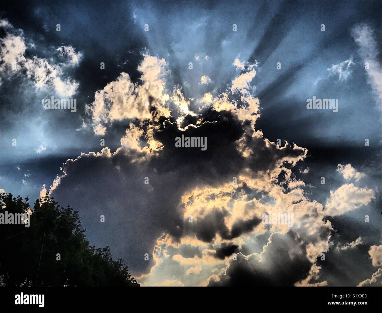 The sun behind clouds in Mexico City, Mexico - Smartphone Captured Stock Image