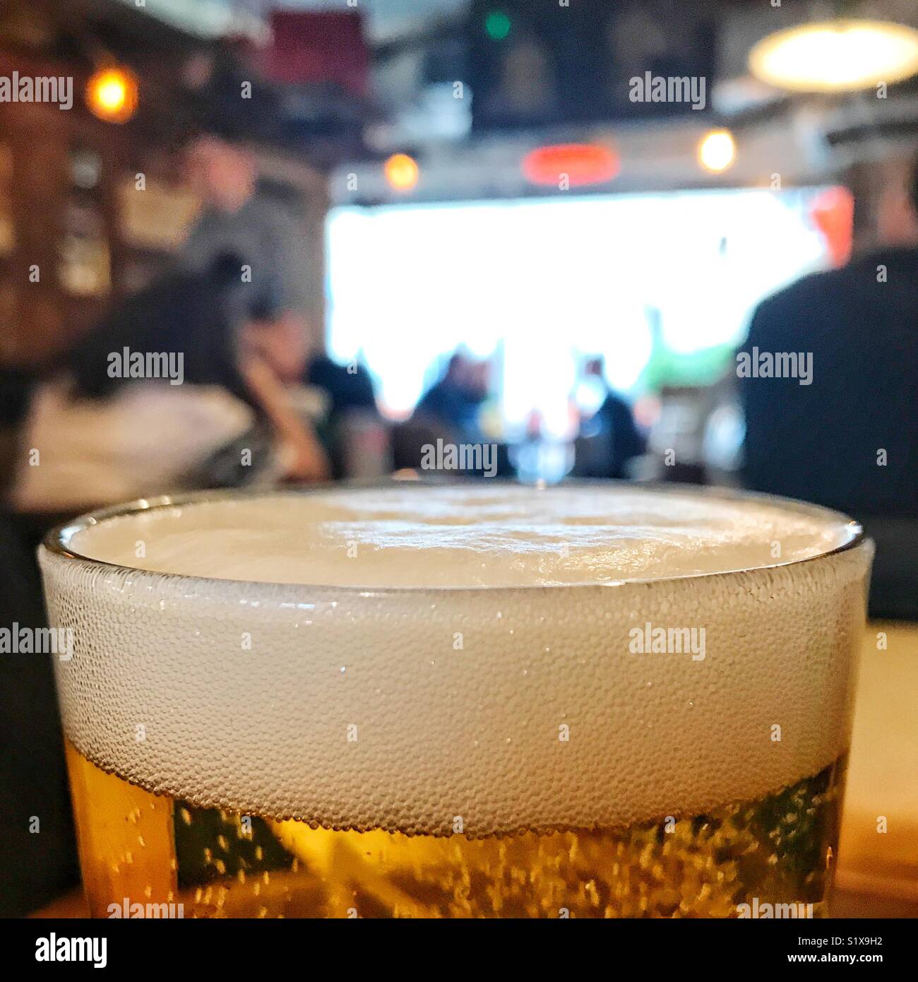 Drinking beer at the pub - Smartphone Captured Stock Image
