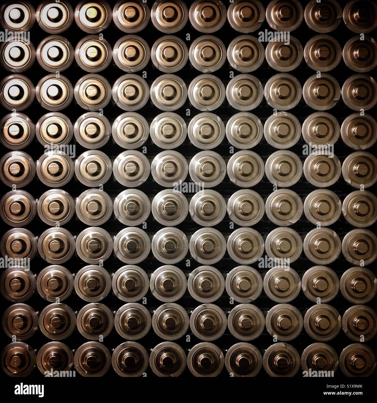 One hundred batteries Stock Photo