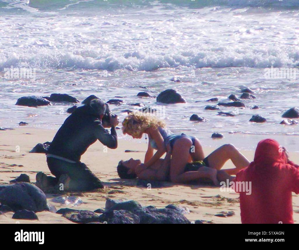 Hard cinema work on the beach. - Smartphone Captured Stock Image