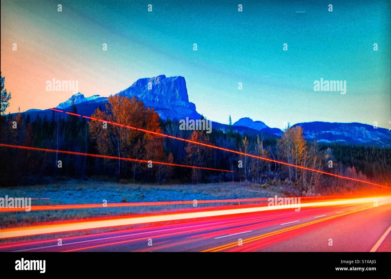 Mountains and tail lights Stock Photo