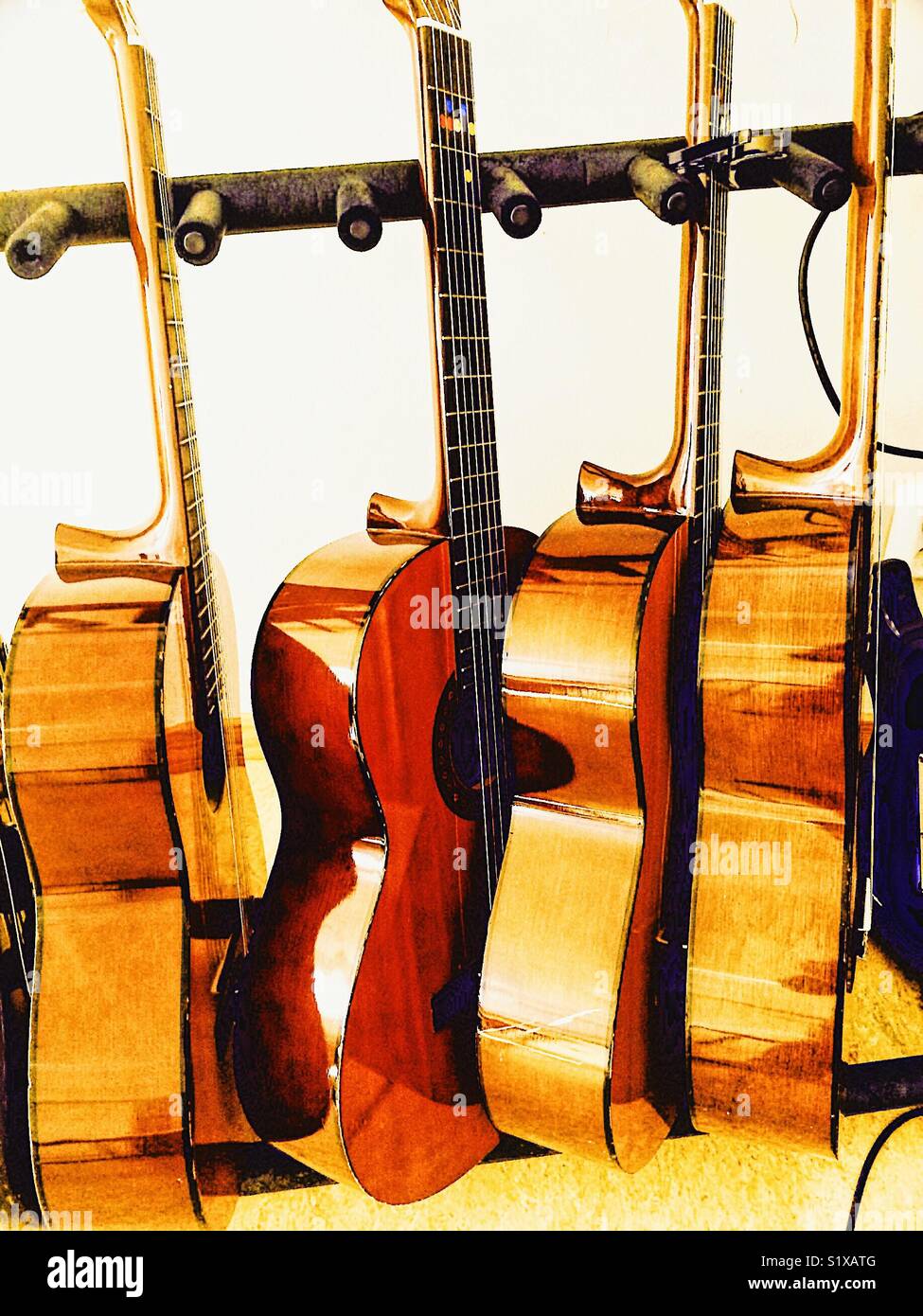 Rack of wooden acoustic guitars - Smartphone Captured Stock Image