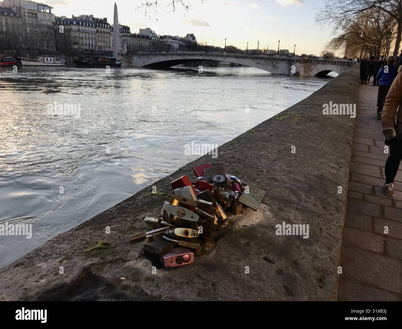 Love locks in Paris. Is it a burden or love expression? - Smartphone Captured Stock Image