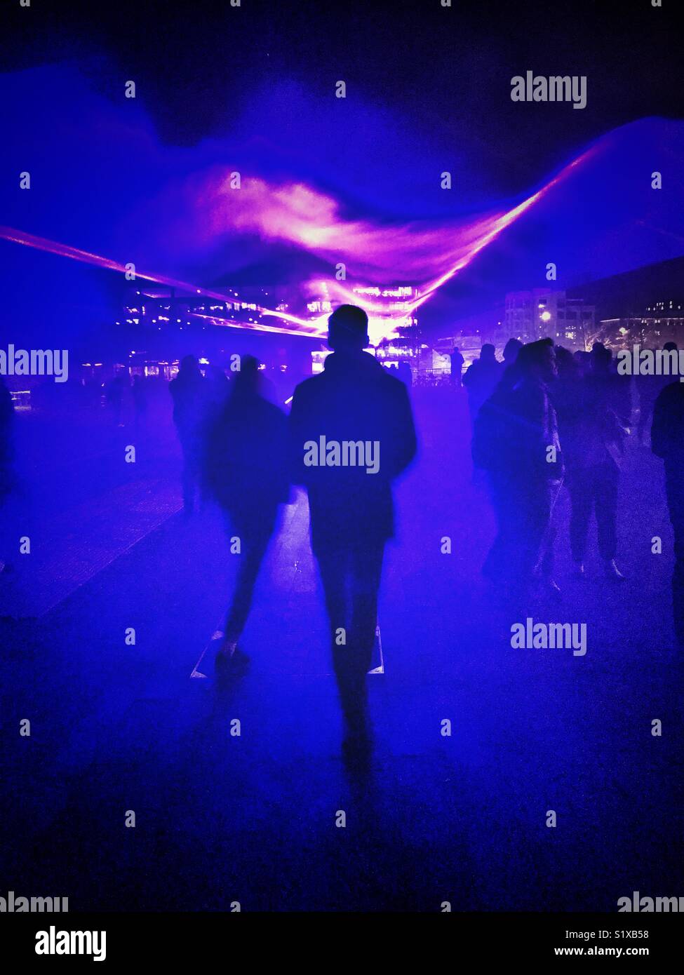 People walking through a display at Lumiere London - Smartphone Captured Stock Image