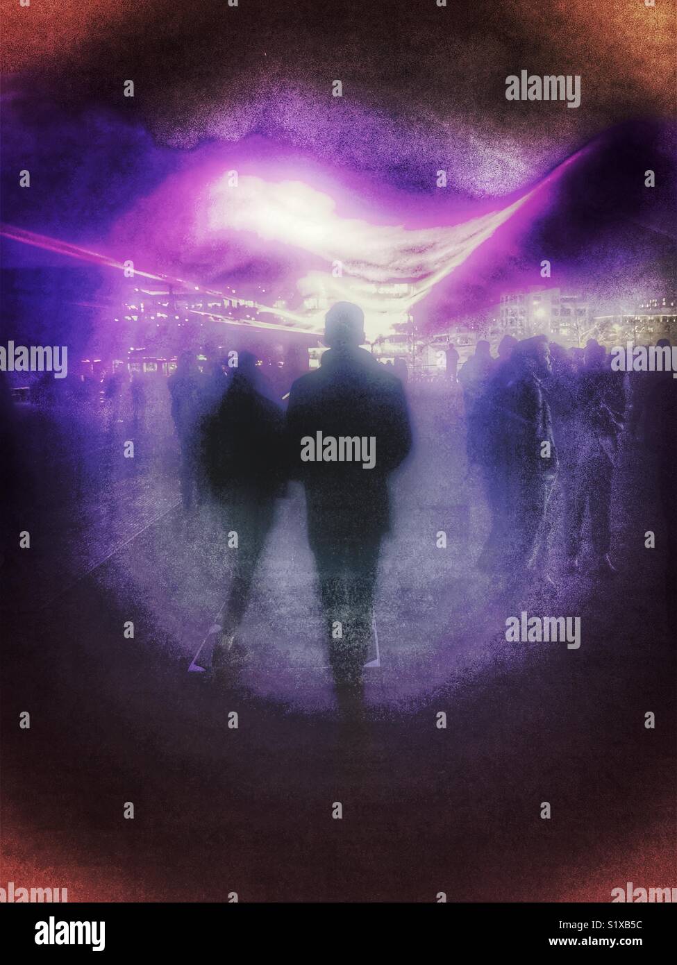 Abstract of a rear view of a couple walking into the distance - Smartphone Captured Stock Image