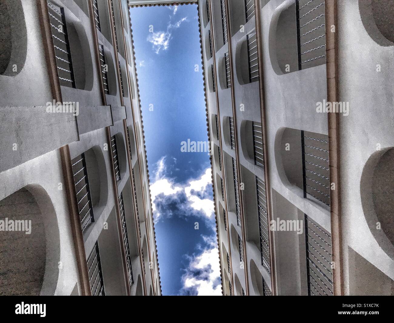Interior courtyard of a Spanish apartment block, low angle view - Smartphone Captured Stock Image Interior courtyard of a Spanish apartment block, low angle view - Smartphone Captured Stock Image
