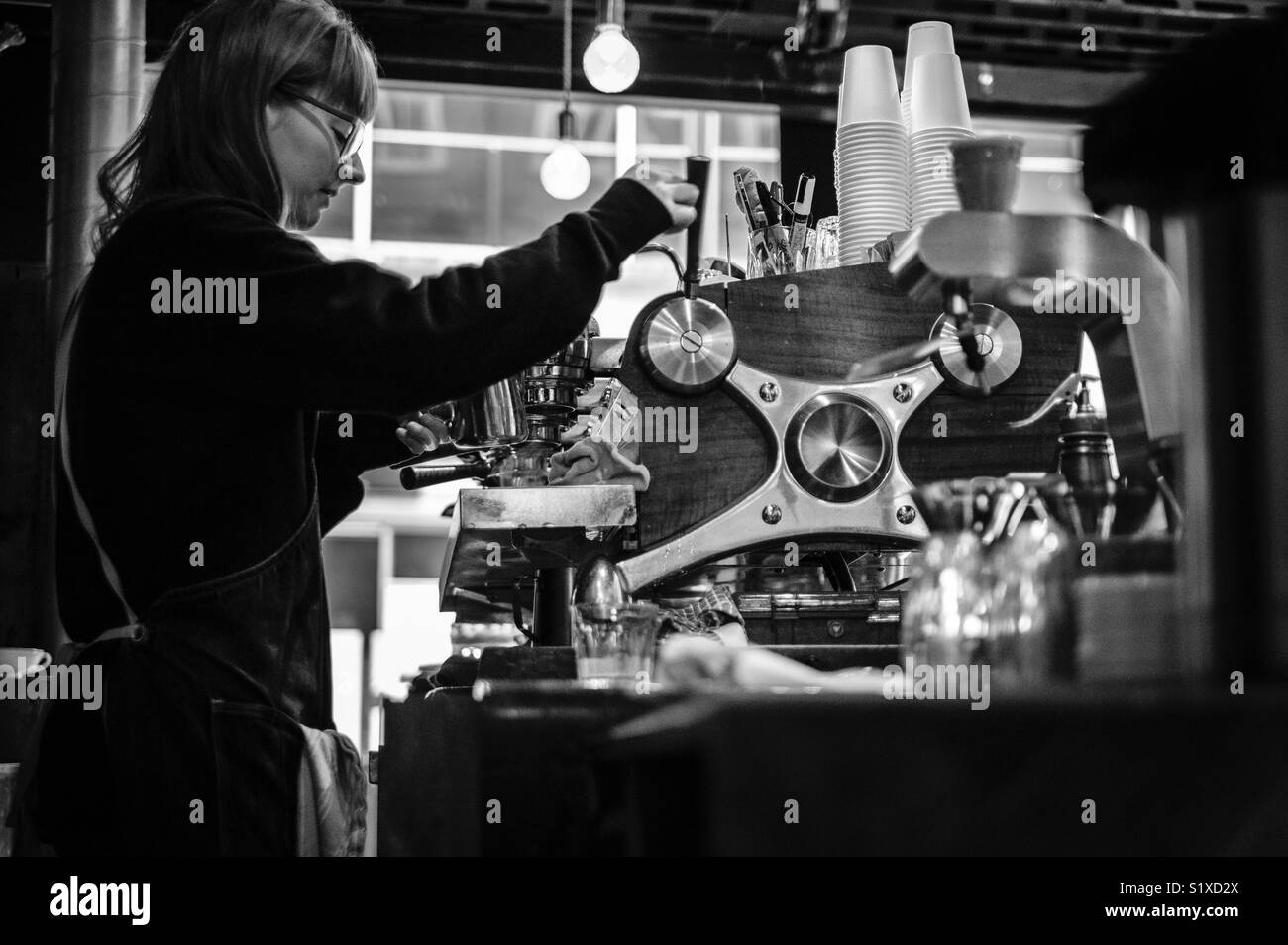 A Barista at work, Leeds, West Yorkshire, England. - Smartphone Captured Stock Image