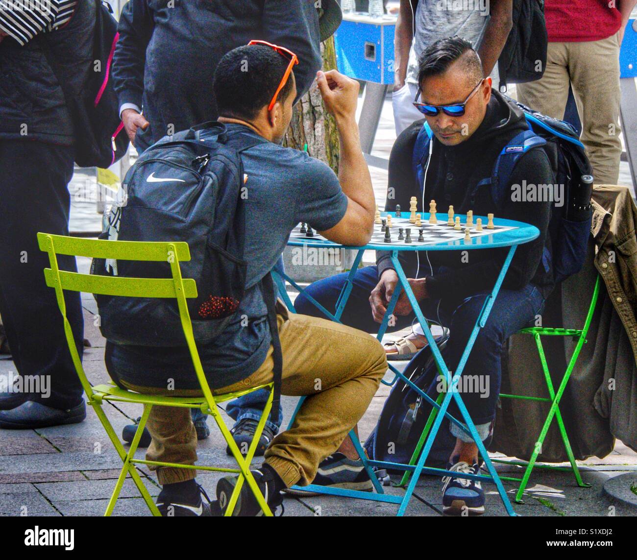 Couple of guys playing chess in the park at Westlake Center in Seattle Washington - Smartphone Captured Stock Image