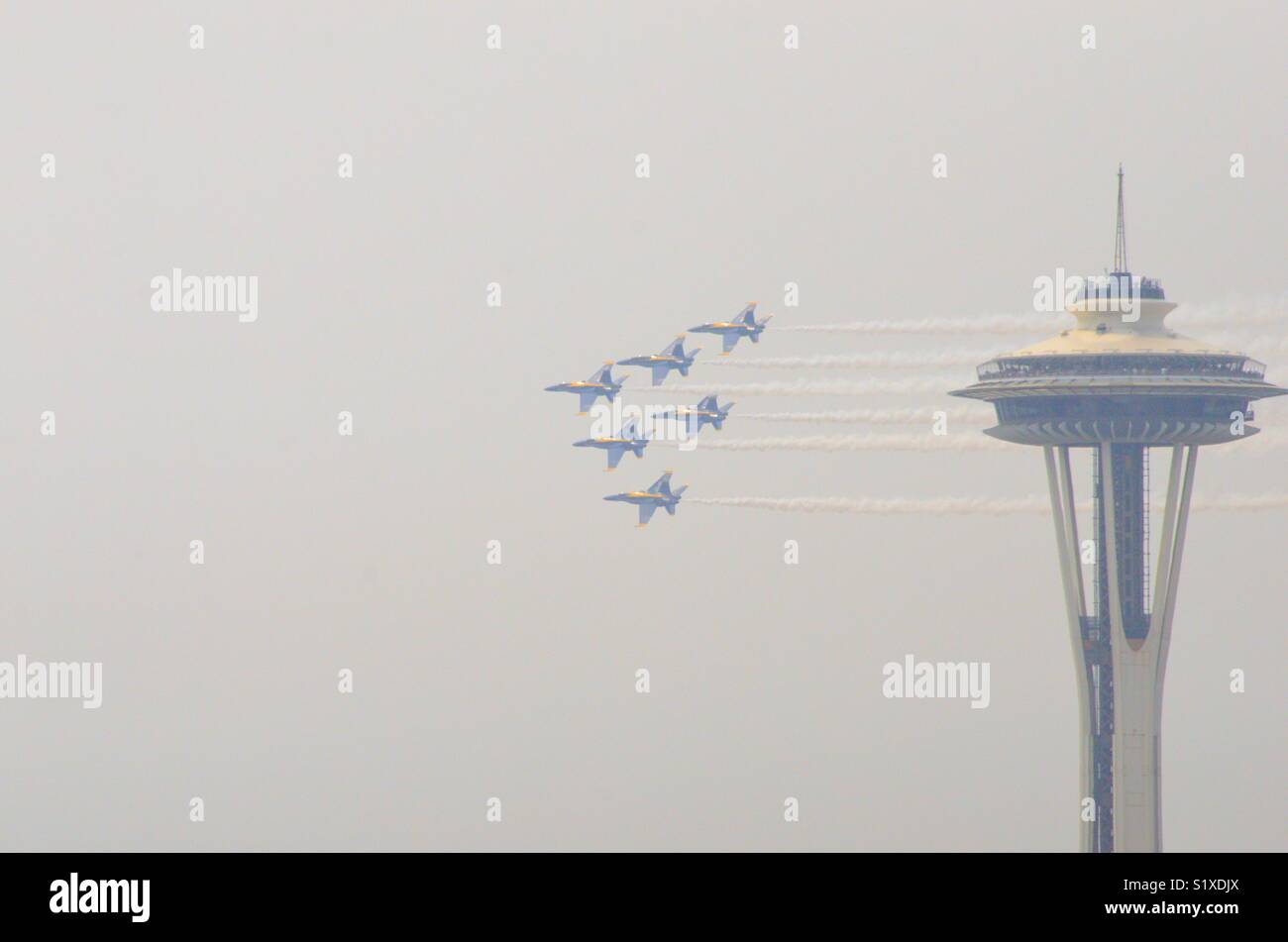 Blue Angels flying in formation past the Space Needle. Seattle Washington - Smartphone Captured Stock Image Blue Angels flying in formation past the Space Needle. Seattle Washington - Smartphone Captured Stock Image