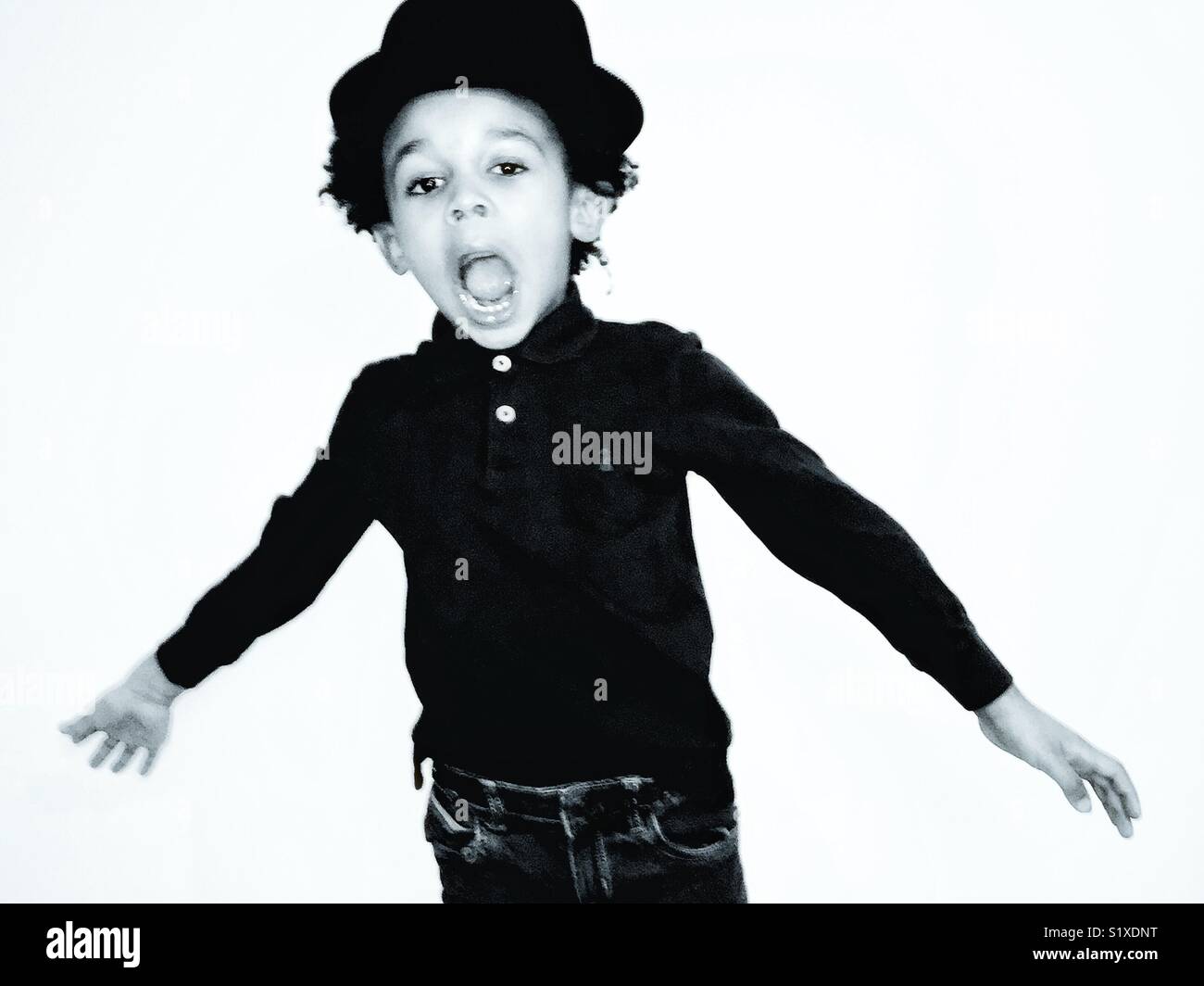 Boy in a hat jumping. Stock Photo