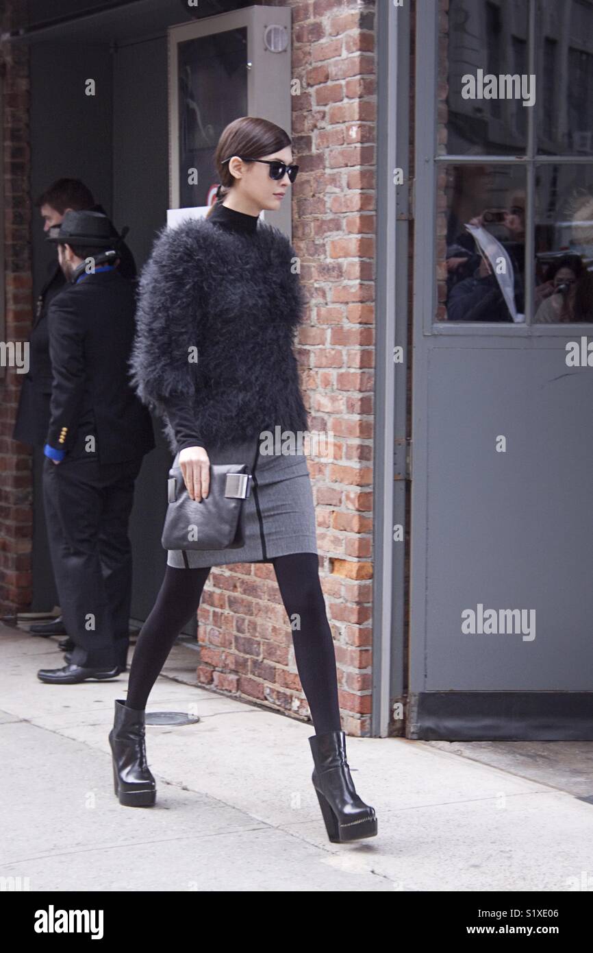 Louise Roe wearing the patent leather boots trend at NYFW 1