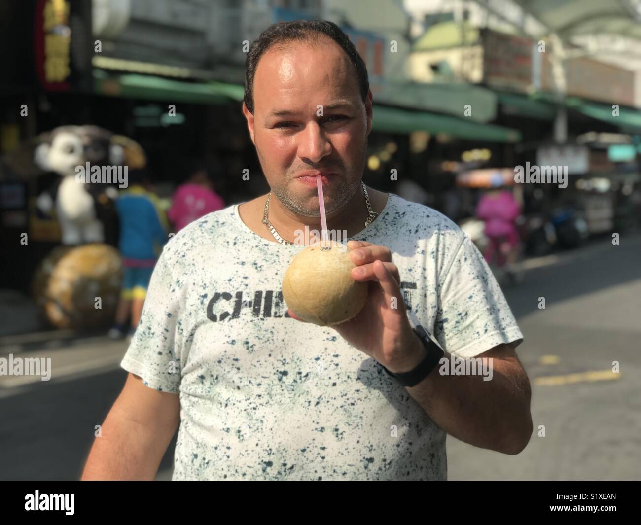 Drinking coconut water - Smartphone Captured Stock Image