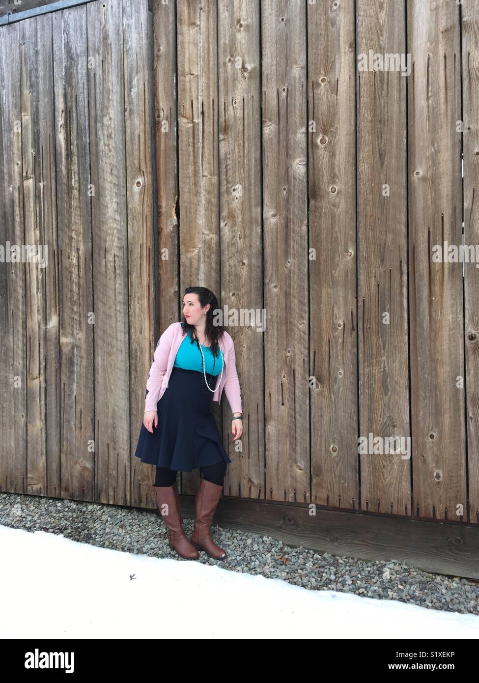 Just nonchalantly leaning against this barn and thinking/pondering life Stock Photo