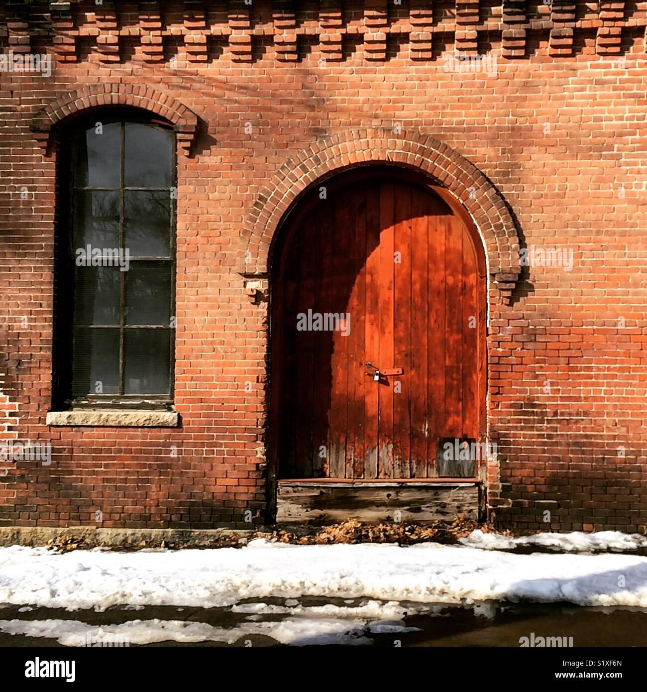 Detail of an old brick building in Turners Falls, Massachusetts, United States - Smartphone Captured Stock Image