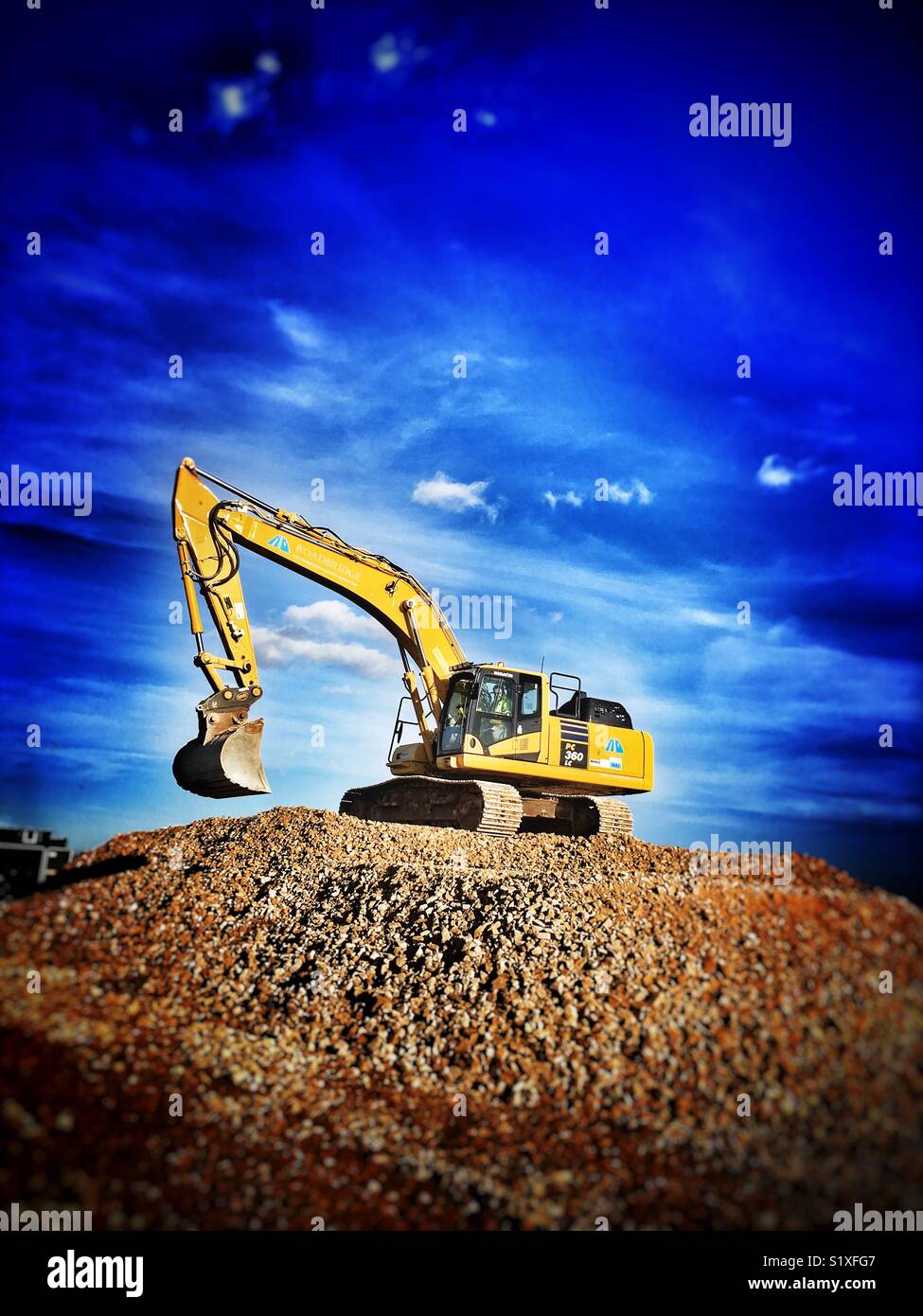 Komatsu PC 360 LC digger working on the East Anglia One wind farm underground electric cable project, Bawdsey, Suffolk, UK. - Smartphone Captured Stock Image