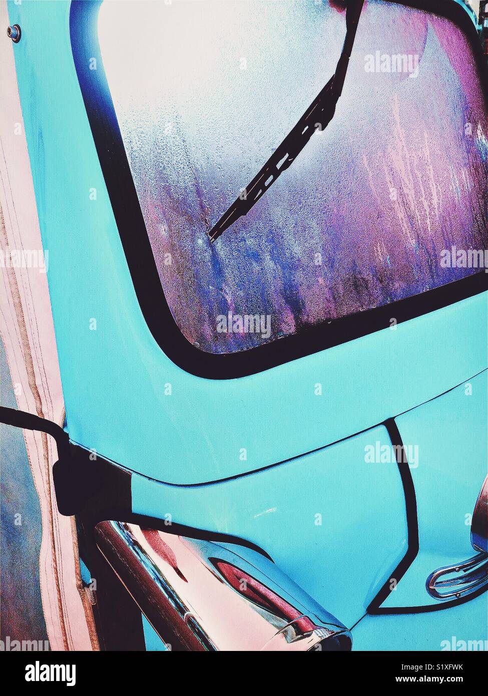 Condensation on blue vehicle windscreen. Stock Photo