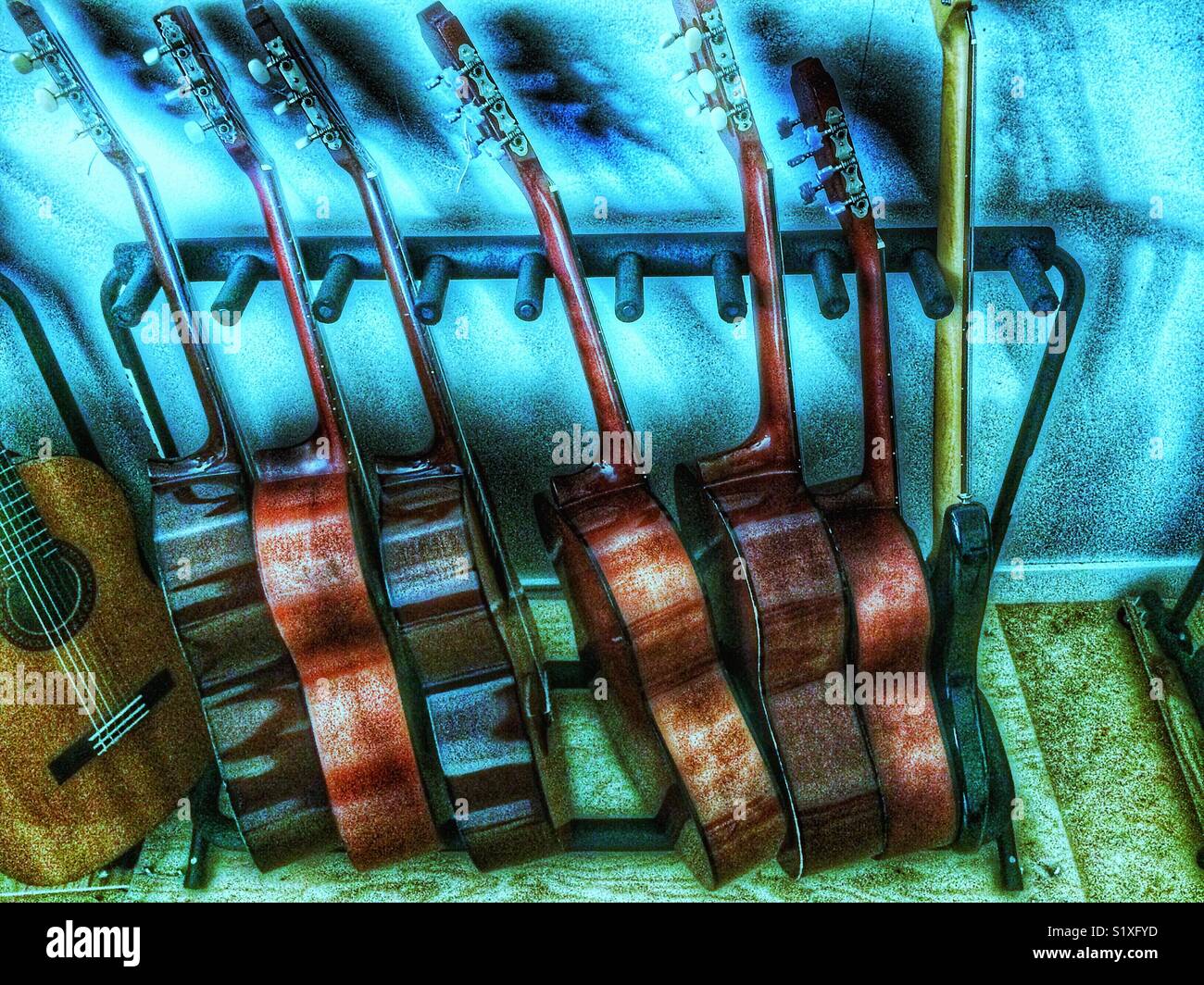 Rack of wooden acoustic guitars - Smartphone Captured Stock Image
