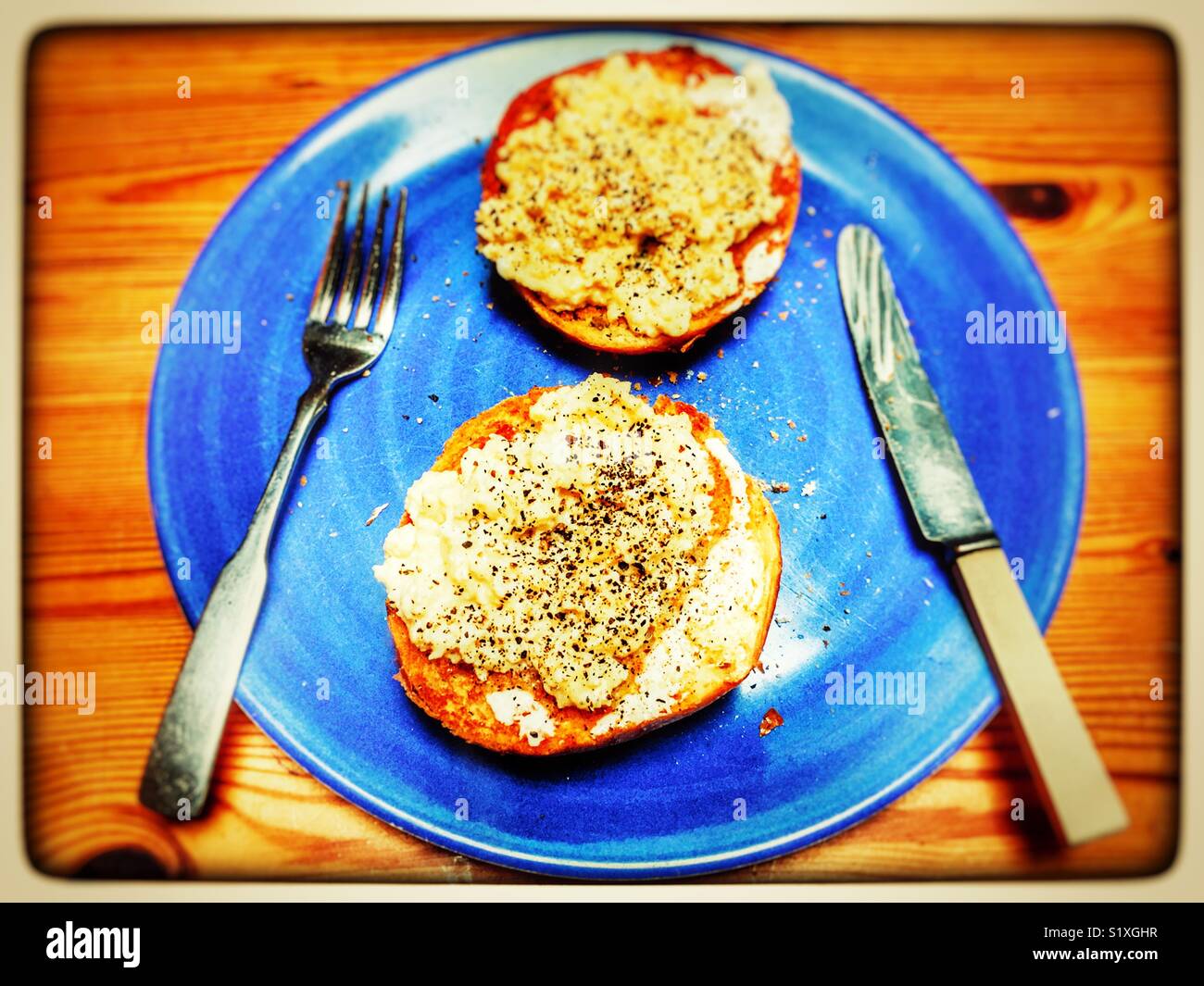 Scrambled egg on toasted roll with cracked black pepper - Smartphone Captured Stock Image