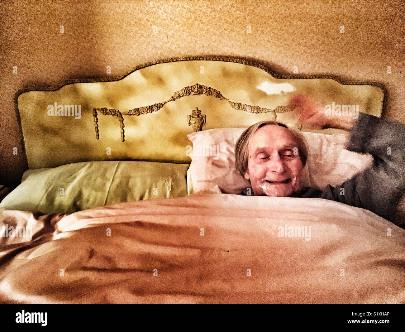 91-year old man happy to have made it through the night - Smartphone Captured Stock Image