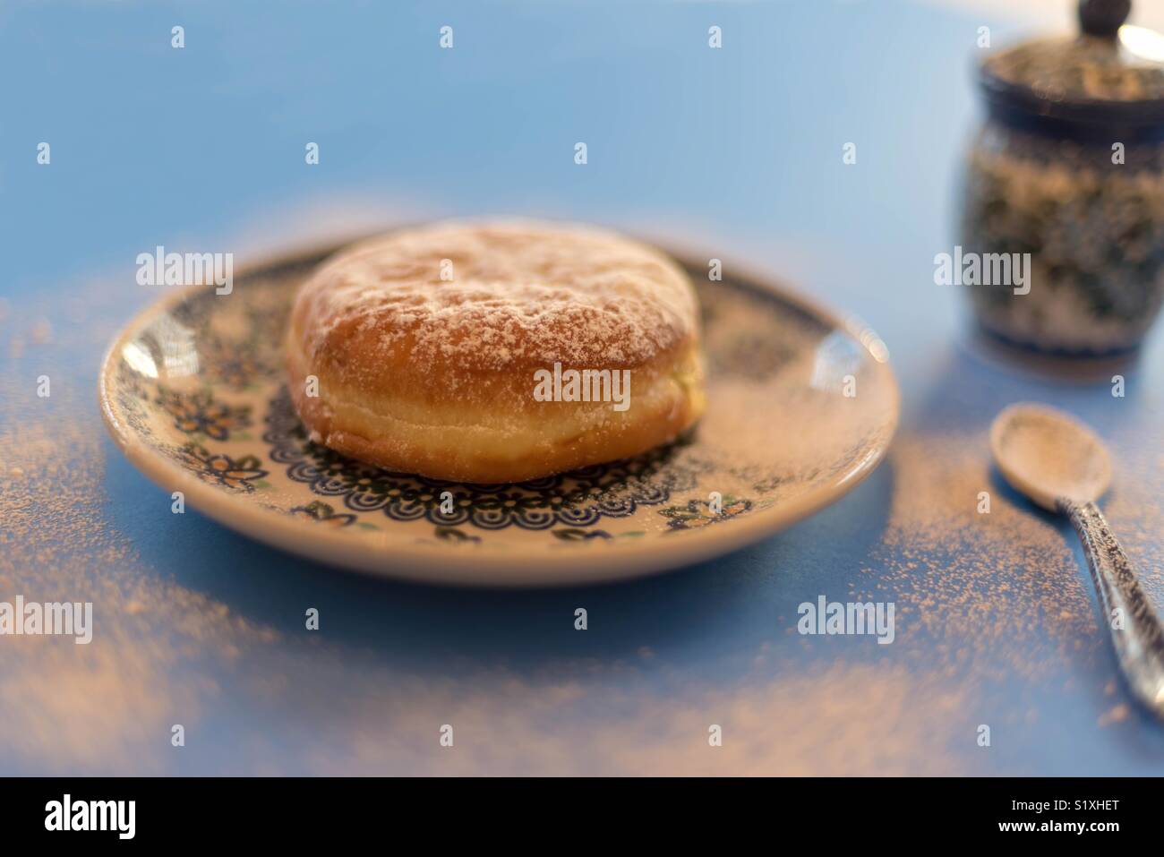Traditional polish Paczki on a polish pottery plate for Fat Tuesday or Paczki Day Stock Photo