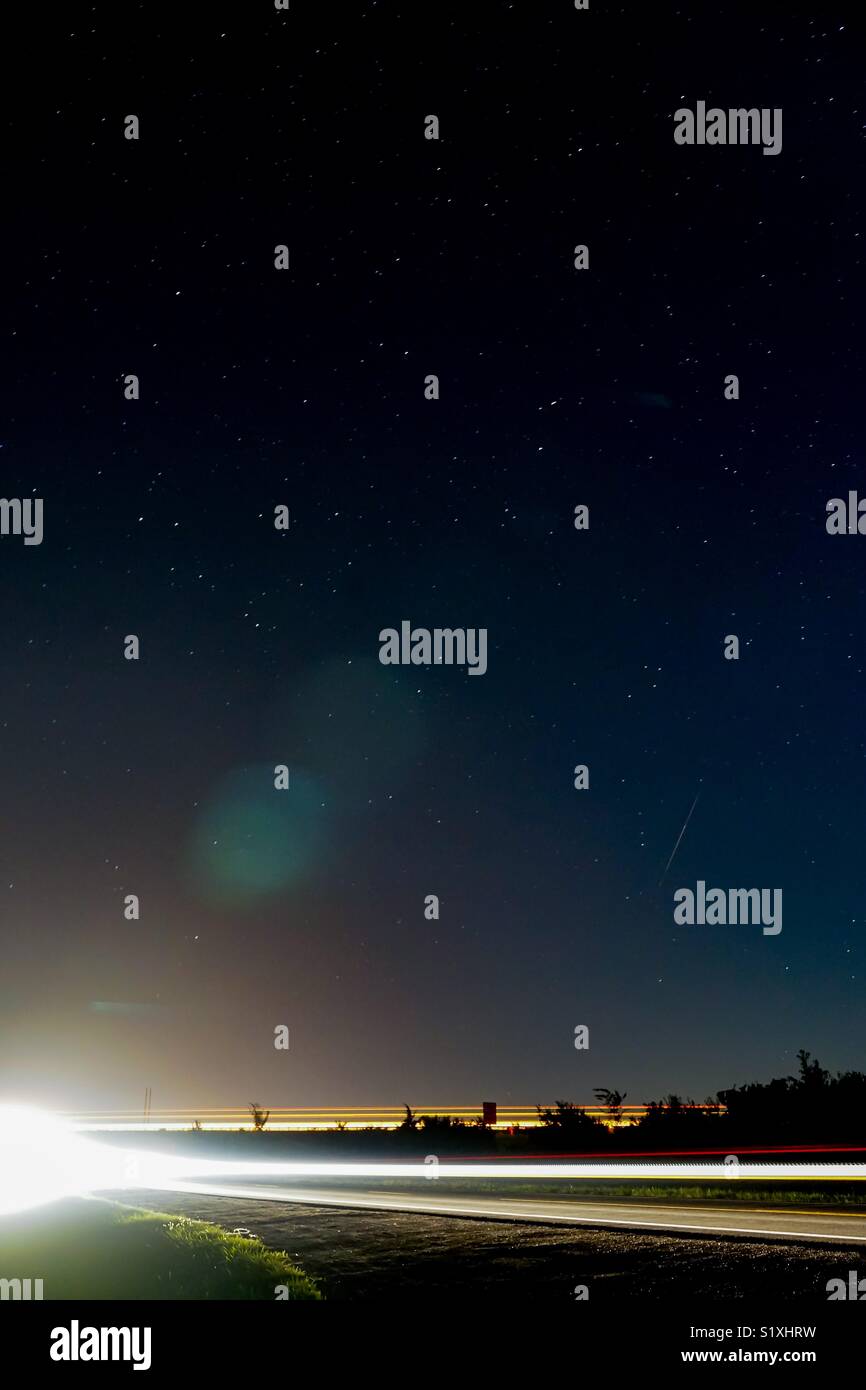 Starry sky with leading headlights Stock Photo Alamy