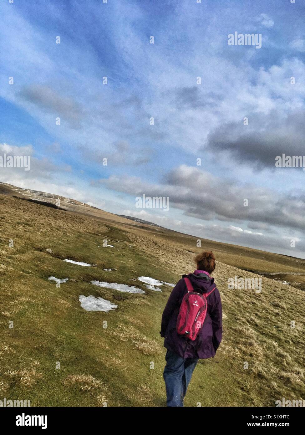 A woman hiking on Malham Lings North Yorkshire - Smartphone Captured Stock Image