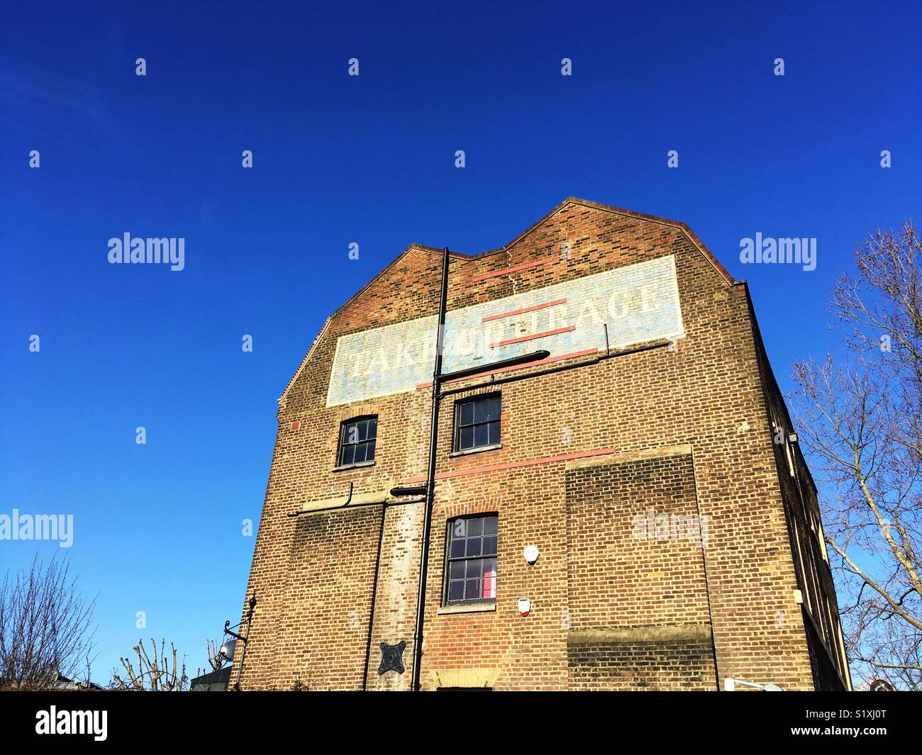 Take Courage Advert on What used to be The Courage & Co. Ltd Brewery Stock Photo