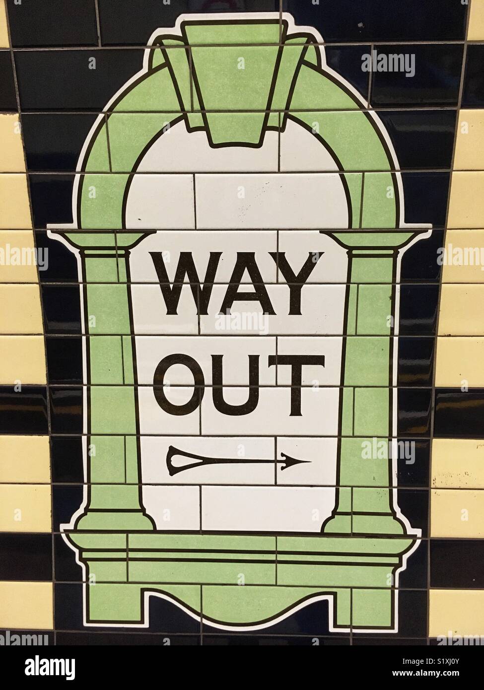 Way out mosaic sign on the wall at Warren Street Underground station in London, England - Smartphone Captured Stock Image
