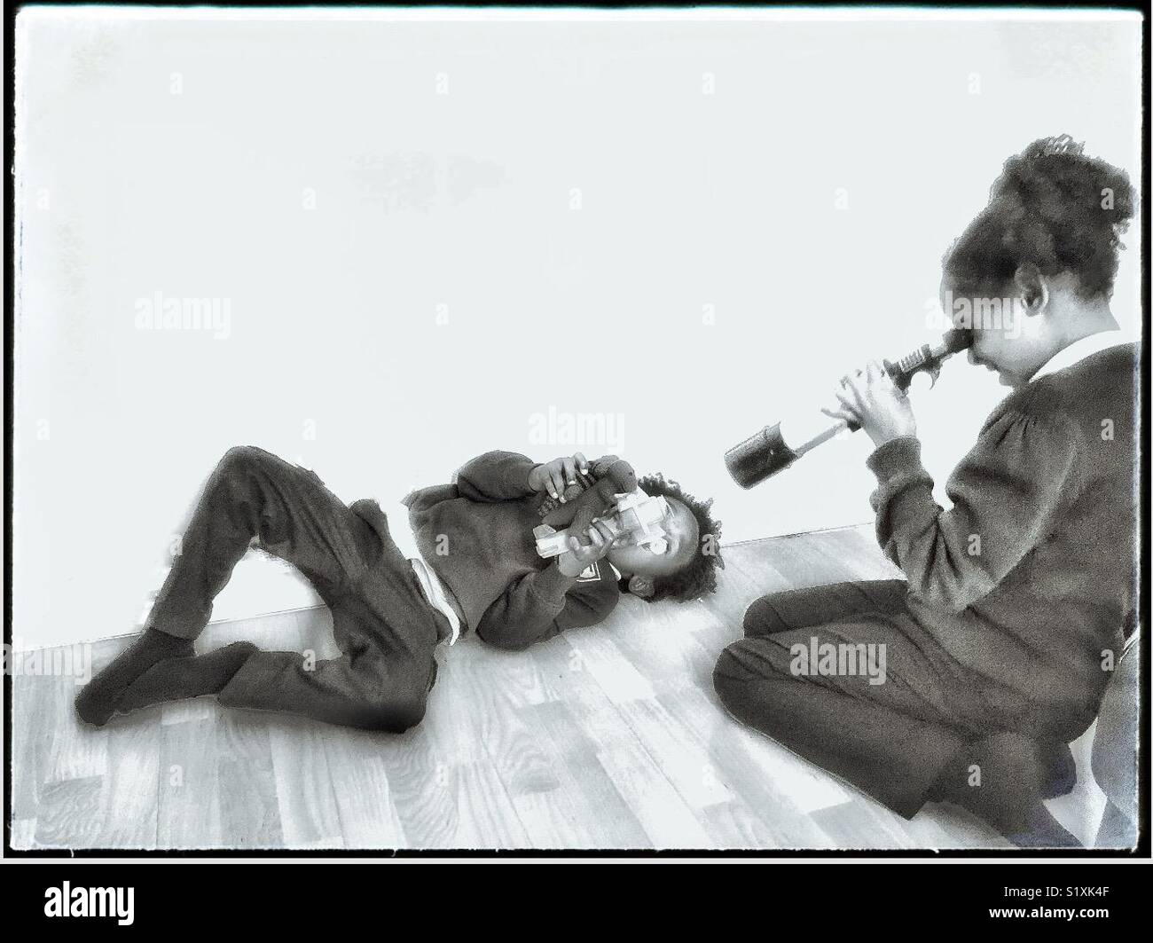 Children playing at home. - Smartphone Captured Stock Image