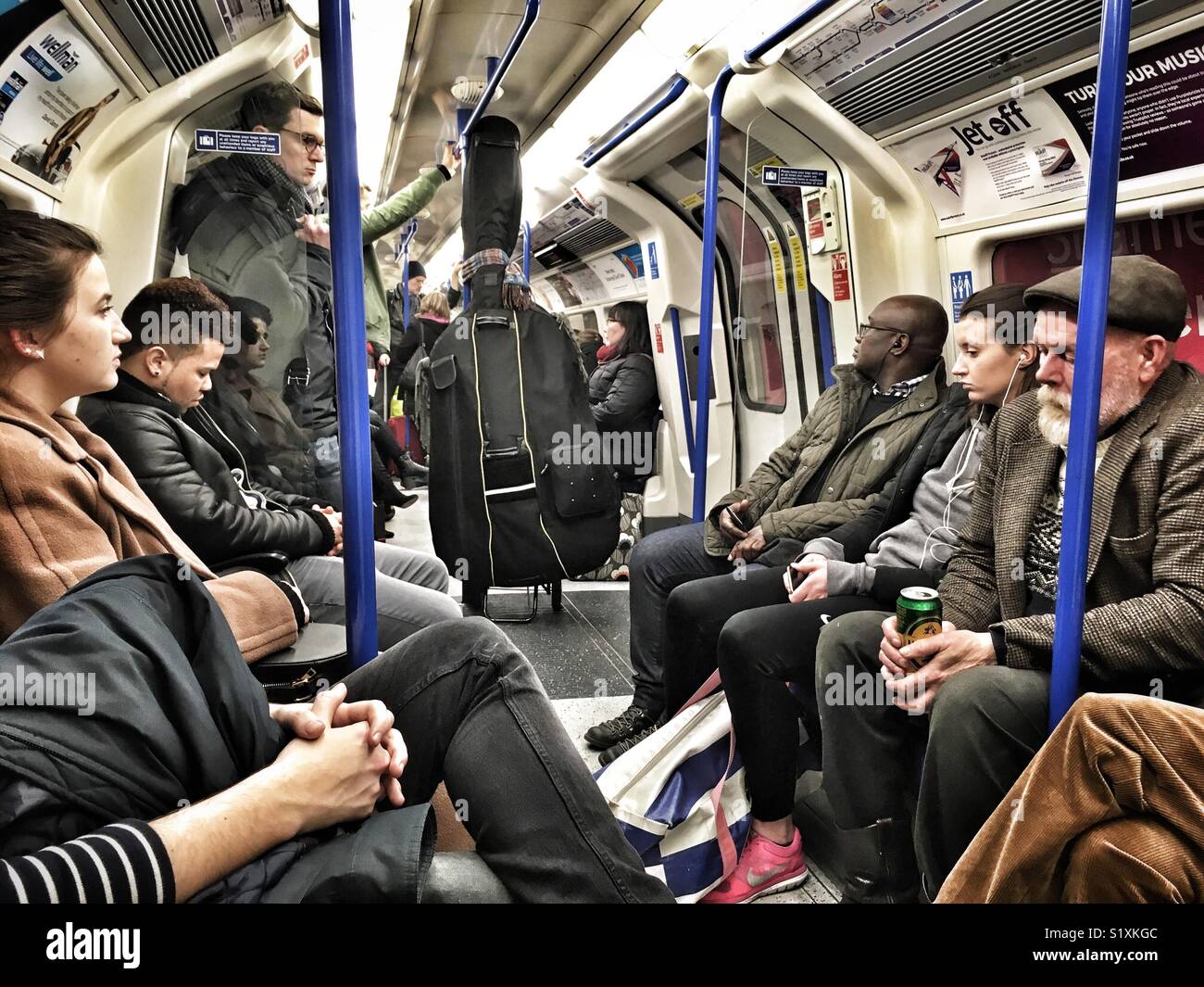A double bass on the London Underground - Smartphone Captured Stock Image