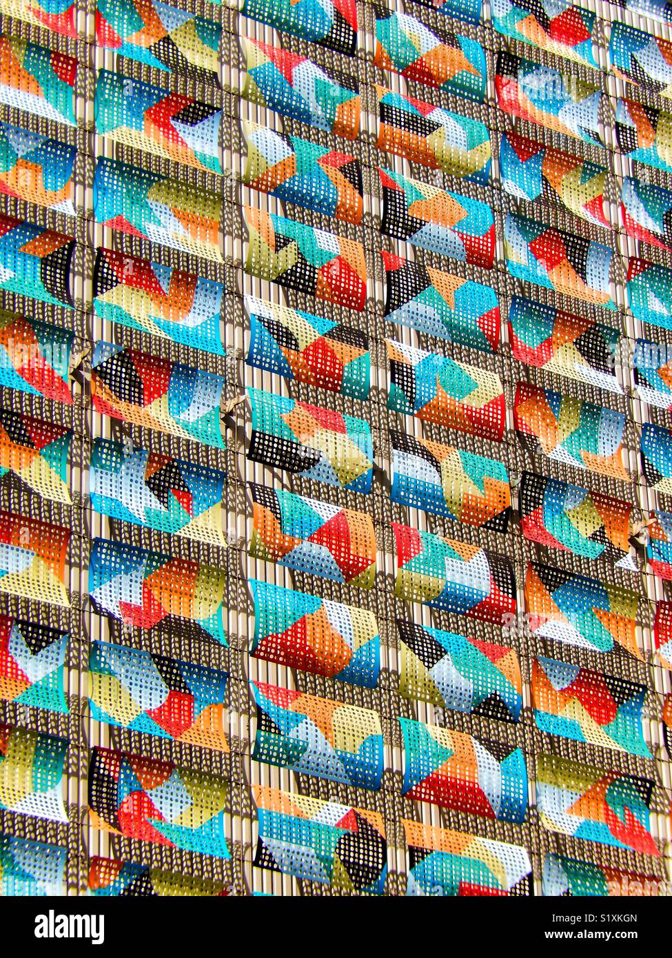 Colorful metal cladding brightens up the wall of a building - Smartphone Captured Stock Image