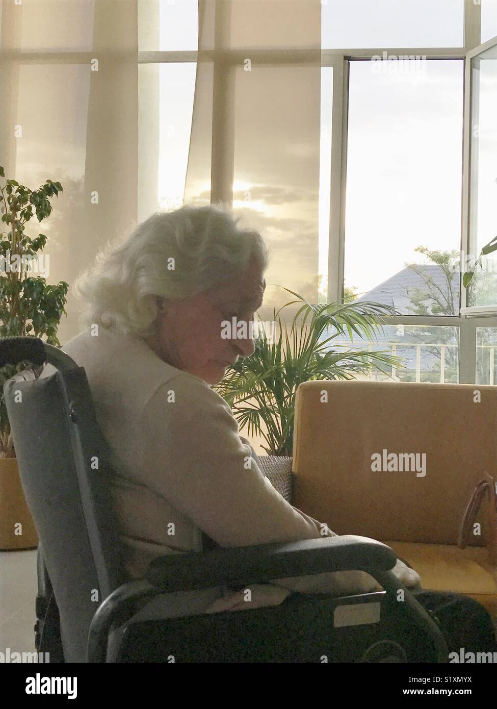 Nostalgic old woman in a nursing home. - Smartphone Captured Stock Image