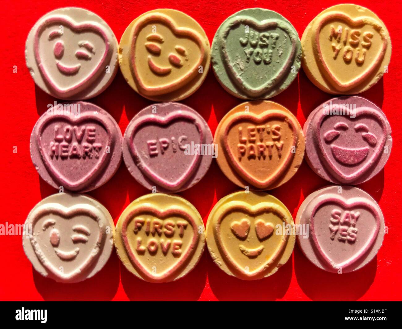 Love Hearts, sweets with word messages and emoticons - Smartphone Captured Stock Image