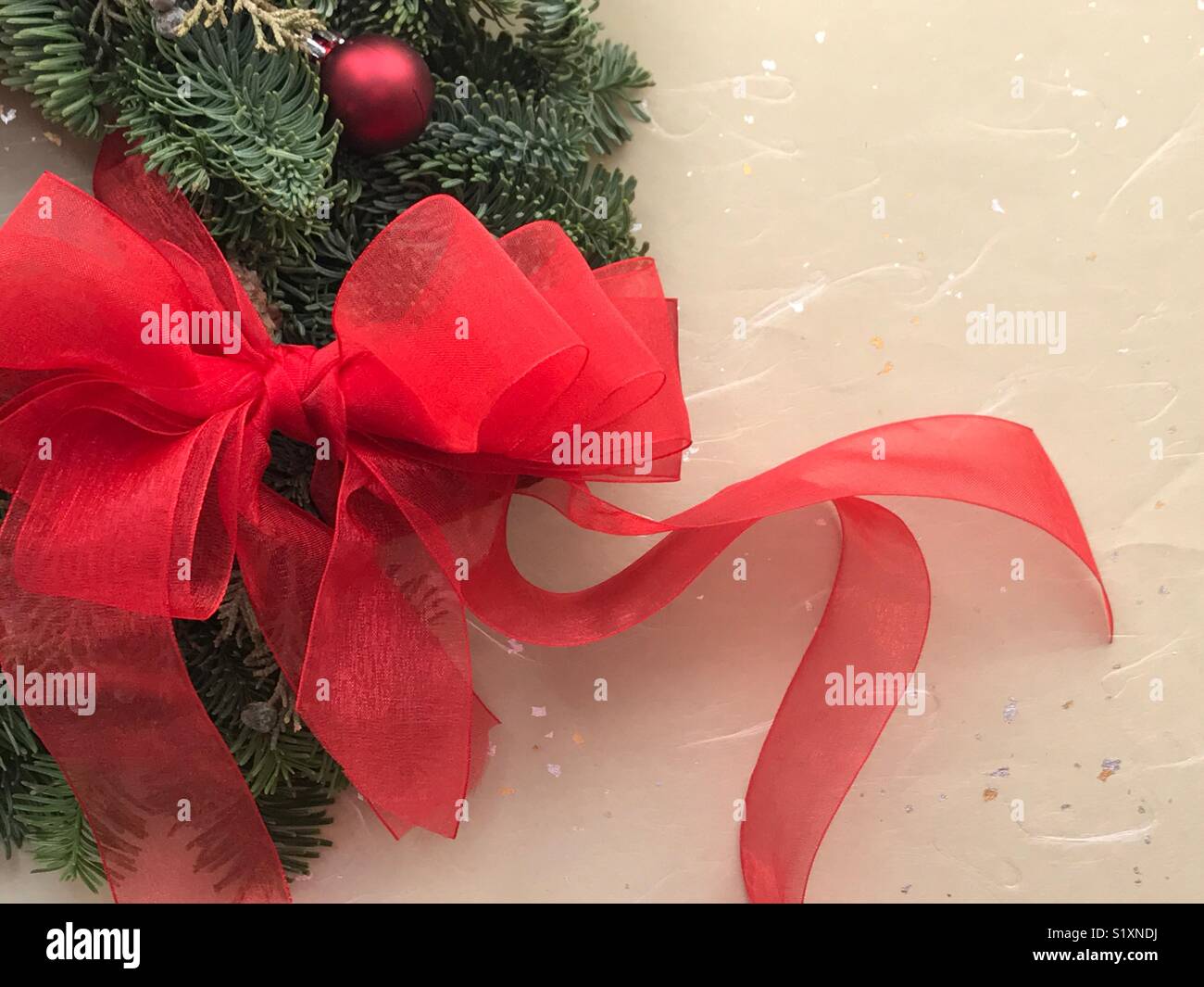 Red bow on Christmas wreath with copy space - Smartphone Captured Stock Image