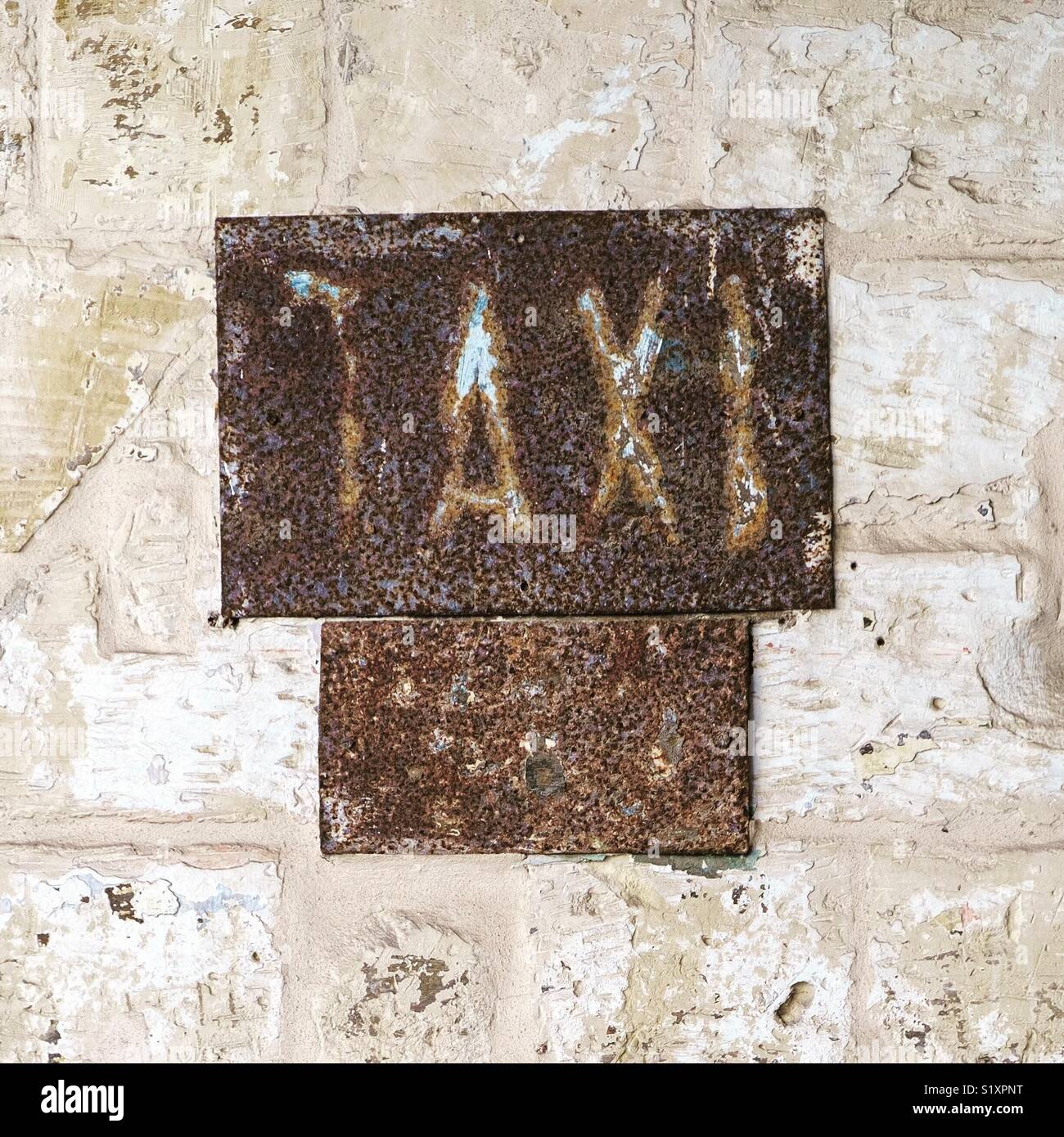 Rusty taxi sign. - Smartphone Captured Stock Image