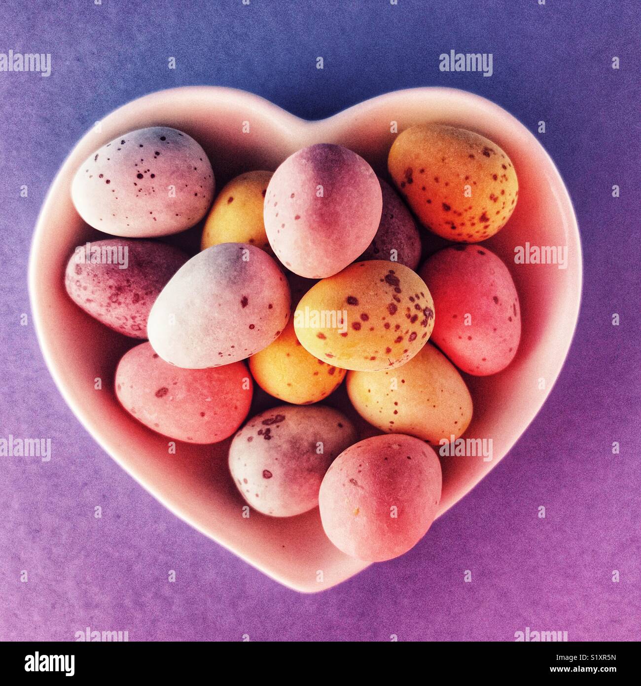 chocolate Easter eggs in a ceramic heart shaped dish - Smartphone Captured Stock Image