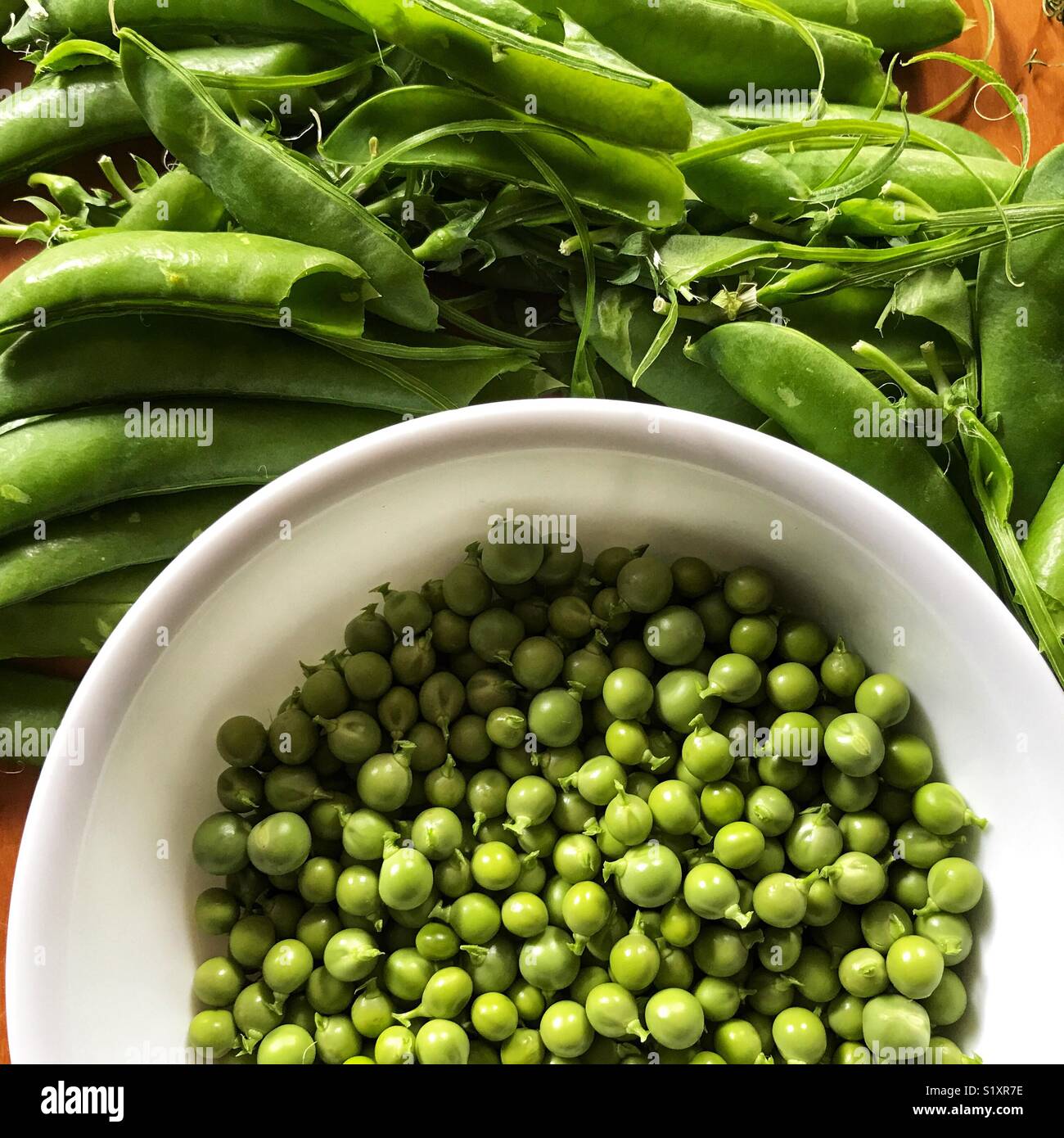 Fresh garden peas in a bowl Stock Photo